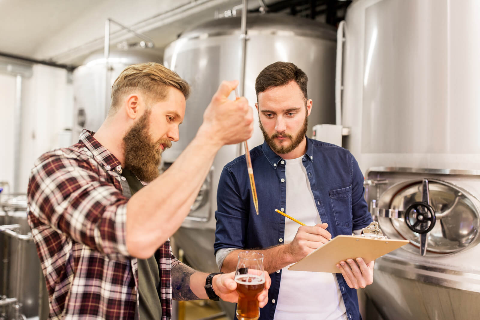 alcohol production, manufacture, business and people concept – m
